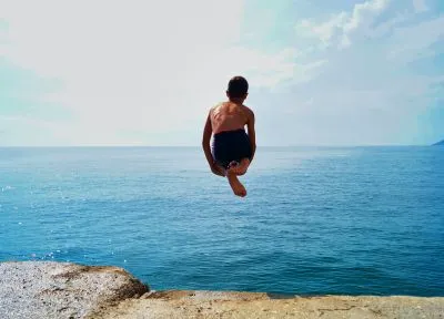 time lapse photography of boy in black shorts jumping on 1655822
